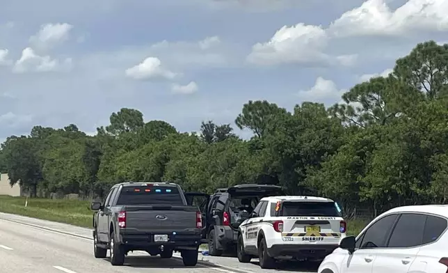 This photo provided by the Martin County Sheriff's Office shows Sheriff's vehicles surrounding an SUV on the northbound I-95 in Martin County on Sunday, Sept. 15, 2024. (Martin County Sheriff's Office via AP)