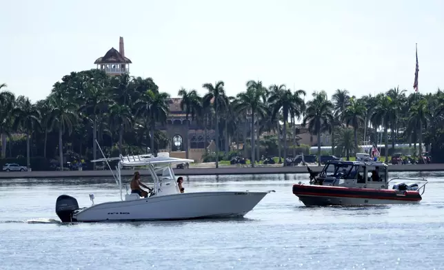 Law enforcement patrols in a boat outside of the Mar-a-Lago estate after the apparent assassination attempt of Republican presidential nominee and former President Donald Trump Monday, Sept. 16, 2024, in Palm Beach, Fla. (AP Photo/Lynne Sladky)