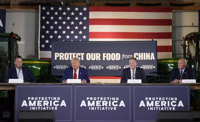 Republican presidential nominee former President Donald Trump speaks at a campaign event at a farm, Monday, Sept. 23, 2024, in Smithton, Pa, as from left, Richard Grenell, Lee Zeldin and Rep. Glenn Thompson, R-Pa., listen. (AP Photo/Alex Brandon)