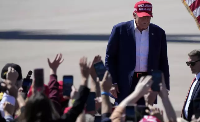 Republican presidential nominee former President Donald Trump arrives to speak during a campaign event at Central Wisconsin Airport, Saturday, Sept. 7, 2024, in Mosinee, Wis. (AP Photo/Morry Gash)