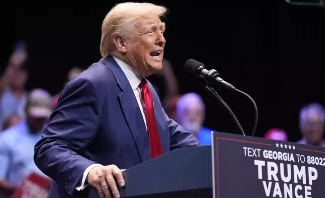 Republican presidential nominee former President Donald Trump speaks about the tax code and manufacturing at the Johnny Mercer Theatre Civic Center, Tuesday, Sept. 24, 2024, in Savannah, Ga. (AP Photo/Evan Vucci)