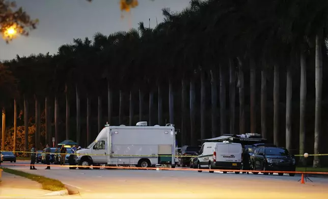 Police crime scene vehicles are seen at Trump International Golf Club after police closed off the area following the apparent assassination attempt of Republican presidential nominee former President Donald Trump in West Palm Beach, Fla., Sunday, Sept. 15, 2024. (AP Photo/Terry Renna)