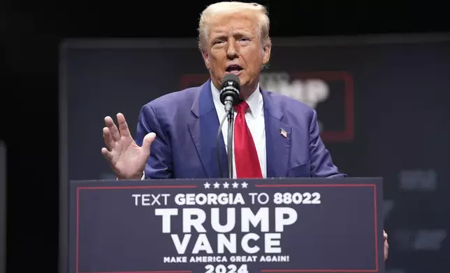 Republican presidential nominee former President Donald Trump speaks about the tax code and manufacturing at the Johnny Mercer Theatre Civic Center, Tuesday, Sept. 24, 2024, in Savannah, Ga. (AP Photo/Evan Vucci)