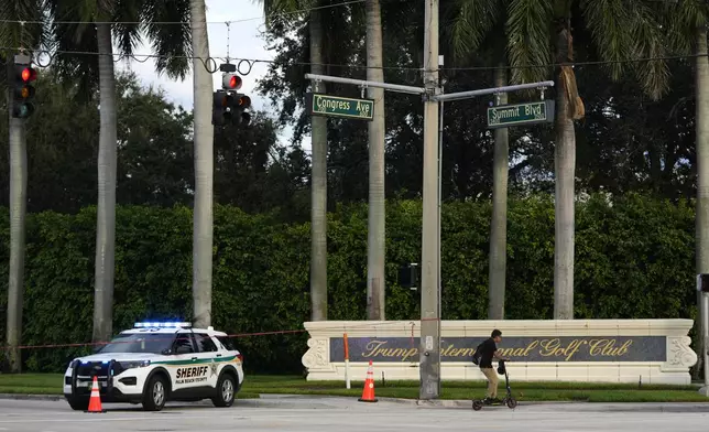 A vehicle with the Palm Beach County Sheriff's office is parked outside of Trump International Golf Club after the apparent assassination attempt of Republican presidential nominee and former President Donald Trump, Monday, Sept. 16, 2024, in West Palm Beach, Fla. (AP Photo/Lynne Sladky)