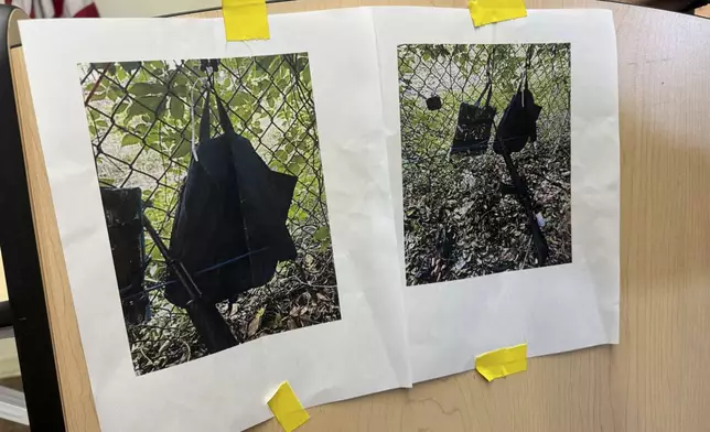 Photos that show an AK-47 rifle, a backpack and a Go-Pro camera on a fence outside Trump International Golf Club taken after an apparent assassination attempt of Republican presidential candidate former President Donald Trump, are displayed during a news conference at the Palm Beach County Main Library, Sunday. Sept. 15, 2024, in West Palm Beach, Fla. (AP Photo/Stephany Matat)