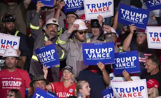 Members of the crowd dance as they wait for Republican presidential nominee former President Donald Trump to begin speaking during a campaign rally at Ed Fry Arena in Indiana, Pa., Monday, Sept. 23, 2024. (AP Photo/Rebecca Droke)