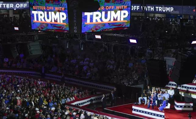 Republican presidential candidate former President Donald Trump on stage with Arkansas Gov. Sarah Huckabee Sanders during a town hall event at the Dort Financial Center, Tuesday, Sept. 17, 2024, in Flint, Mich. (AP Photo/Evan Vucci)