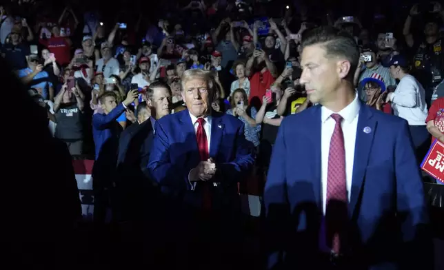 Republican presidential candidate former President Donald Trump is introduced for a town hall event at the Dort Financial Center, Tuesday, Sept. 17, 2024, in Flint, Mich. (AP Photo/Evan Vucci)