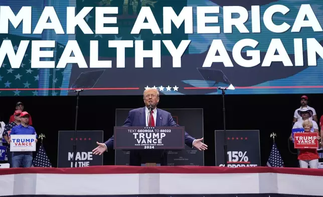 Republican presidential nominee former President Donald Trump speaks about the tax code and manufacturing at the Johnny Mercer Theatre Civic Center, Tuesday, Sept. 24, 2024, in Savannah, Ga. (AP Photo/Evan Vucci)