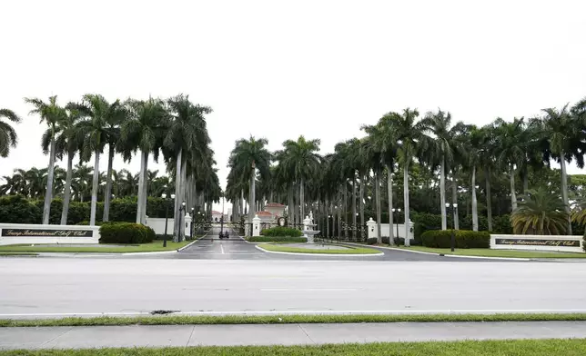 The main entrance of Trump International Golf Club is seen after police closed off the area following the apparent assassination attempt of Republican presidential nominee former President Donald Trump in West Palm Beach, Fla., Sunday, Sept. 15, 2024. (AP Photo/Terry Renna)