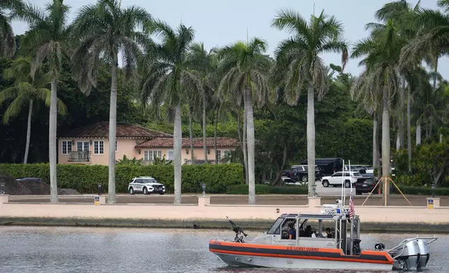 A Coast Guard boat patrols the Lake Worth Lagoon in front of the Mar-a-Lago estate of Republican presidential nominee and former President Donald Trump, one day after an apparent assassination attempt, in Palm Beach, Fla., Monday, Sept. 16, 2024. (AP Photo/Rebecca Blackwell)