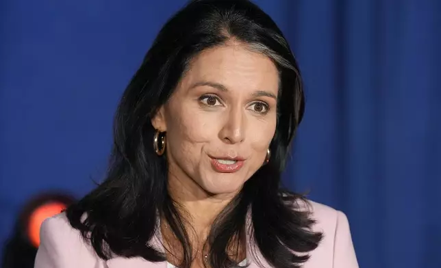 Former Democratic Rep. Tulsi Gabbard answers a question as she speaks to the media after a campaign event for Republican presidential nominee former President Donald Trump, Saturday, Sept. 14, 2024, in Glendale, Ariz. (AP Photo/Ross D. Franklin)