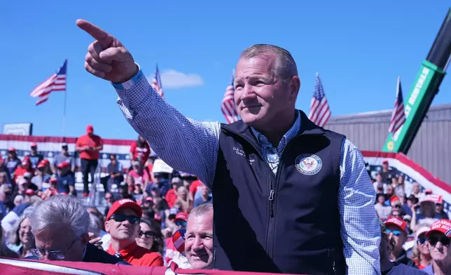 Rep. Troy Nehls, R-Texas, gestures as Republican presidential nominee former President Donald Trump speaks during a campaign event at Central Wisconsin Airport, Saturday, Sept. 7, 2024, in Mosinee, Wis. (AP Photo/Alex Brandon)