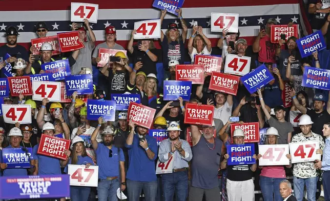 Workers show their support during a campaign event for Republican presidential nominee former President Donald Trump in Johnstown, Pa., Friday, Aug. 30, 2024. (The Tribune-Democrat via AP)