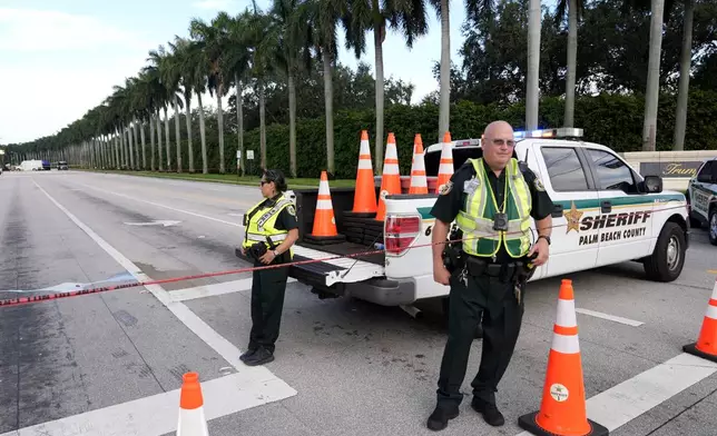 Officers with the Palm Beach County Sheriff's office work outside of Trump International Golf Club after the apparent assassination attempt of Republican presidential nominee and former President Donald Trump Monday, Sept. 16, 2024, in West Palm Beach, Fla. (AP Photo/Lynne Sladky)