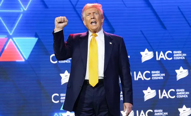 Republican presidential nominee former President Donald Trump acknowledges the crowd after speaking at the Israeli American Council National Summit, Thursday, Sept. 19, 2024, in Washington. (AP Photo/Evan Vucci)