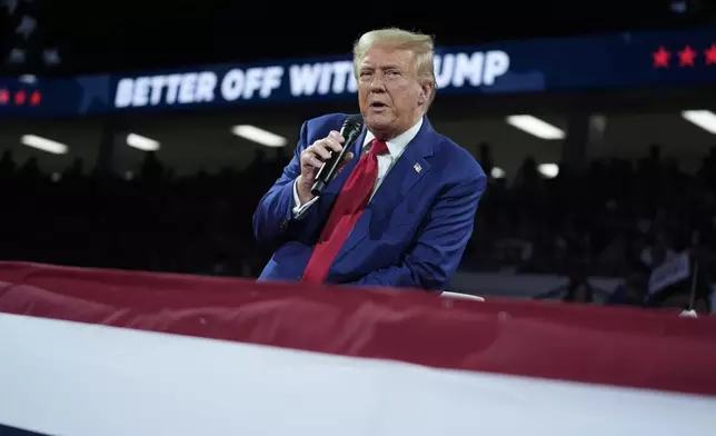 Republican presidential candidate former President Donald Trump speaks during a town hall event at the Dort Financial Center, Tuesday, Sept. 17, 2024, in Flint, Mich. (AP Photo/Evan Vucci)