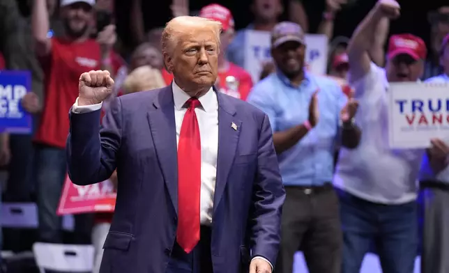 Republican presidential nominee former President Donald Trump arrives to speak about the tax code and manufacturing at the Johnny Mercer Theatre Civic Center, Tuesday, Sept. 24, 2024, in Savannah, Ga. (AP Photo/Evan Vucci)