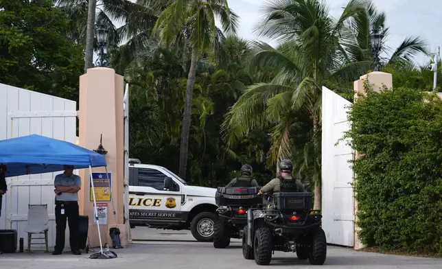 Police drive in to the Mar-a-Lago estate of Republican presidential nominee and former President Donald Trump, one day after an apparent assassination attempt, in Palm Beach, Fla., Monday, Sept. 16, 2024. (AP Photo/Rebecca Blackwell)