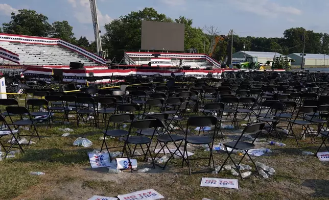 FILE - A campaign rally site for Republican presidential candidate former President Donald Trump is empty and littered with debris July 13, 2024, in Butler, Pa. (AP Photo/Evan Vucci, File)