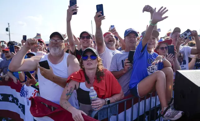 FILE - Supporters cheer as Republican presidential candidate former President Donald Trump arrives for a campaign rally, July 13, 2024, in Butler, Pa. (AP Photo/Evan Vucci, File)