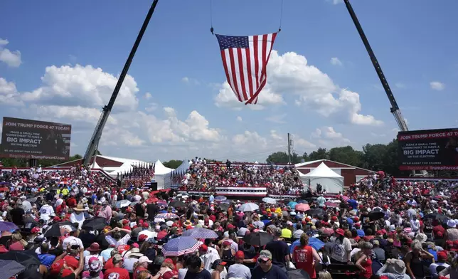 FILE - A crowd waits for Republican presidential candidate former President Donald Trump to speak at a campaign event in Butler, Pa., July 13, 2024. (AP Photo/Gene J. Puskar, File)