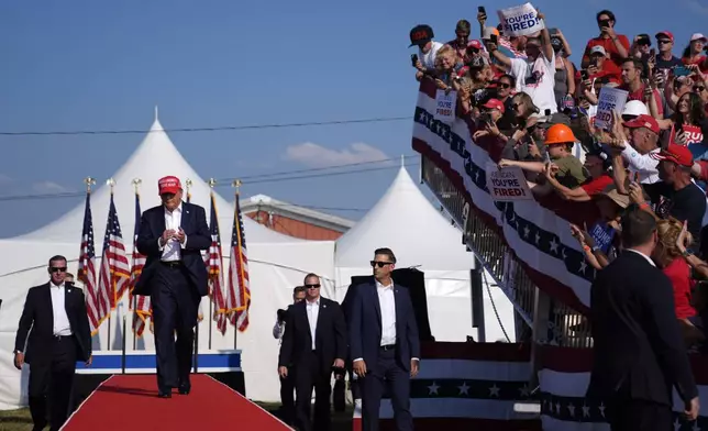 FILE - Republican presidential candidate former President Donald Trump arrives for a campaign rally, July 13, 2024, in Butler, Pa. (AP Photo/Evan Vucci, File)