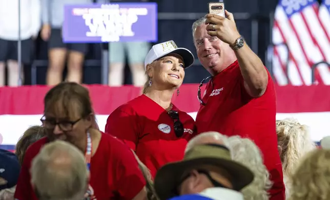 Supporters gather at a rally to hear Republican vice presidential nominee JD Vance, Tuesday, Sept. 17, 2024, at Apple Valley Events in Sparta, Mich. (Isaac Ritchey/The Grand Rapids Press via AP)