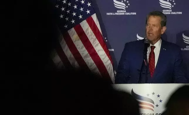 Georgia Gov. Brian Kemp speaks during the Georgia Faith and Freedom Coalition's dinner at the Cobb Galleria Centre, Monday, Sept. 16, 2024, in Atlanta. (AP Photo/Mike Stewart)