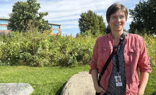 Stephanie Hirsch, city manager for Eau Claire, Wis., who supported the resettlement of refugees in the western Wisconsin city despite opposition from Republicans, poses in a downtown park ahead of a campaign visit from vice presidential candidate JD Vance Tuesday, Sept. 17, 2024. (AP Photo/Scott Bauer)