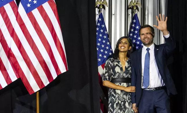 Republican vice presidential nominee JD Vance and his wife Usha Vance, arrive at a campaign stop at Apple Valley Events in Sparta, Mich., Tuesday, Sept. 17, 2024. (Isaac Ritchey/The Grand Rapids Press via AP)