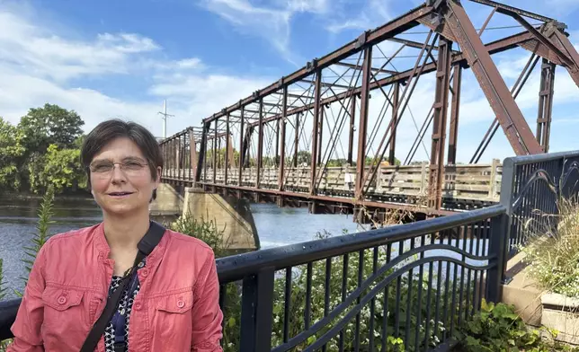 Stephanie Hirsch, city manager for Eau Claire, Wis., who supported the resettlement of refugees in the western Wisconsin city despite opposition from Republicans, poses in a downtown park ahead of a campaign visit from vice presidential candidate JD Vance Tuesday, Sept. 17, 2024. (AP Photo/Scott Bauer)