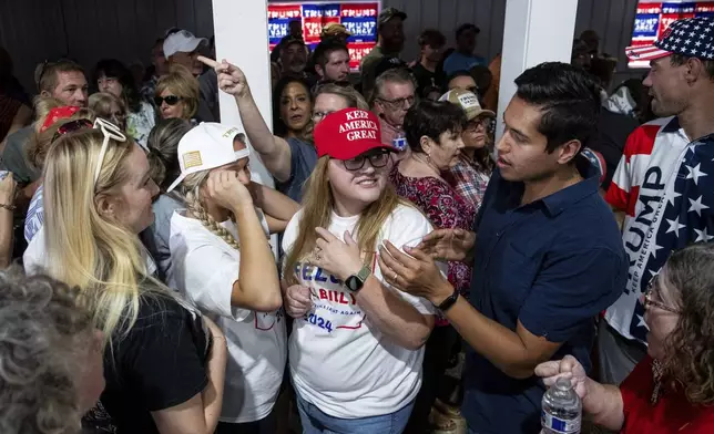 Supporters look for spots in the standing room only section to listen to Republican vice presidential nominee JD Vance, Tuesday, Sept. 17, 2024, at Apple Valley Events in Sparta, Mich. (Isaac Ritchey/The Grand Rapids Press via AP)