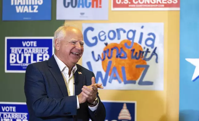 Democratic vice presidential candidate Tim Walz speaks to supporters at a Democratic campaign office in Macon, Ga., Tuesday, Sept. 17, 2024. (Arvin Temkar/Atlanta Journal-Constitution via AP)