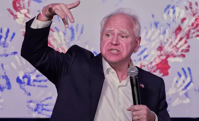 Democratic vice presidential candidate Minnesota Gov. Tim Walz speaks at the Whitewater Music Hall Brewing Company Friday, Sept. 13, 2024, in Wausau, Wis. (AP Photo/Morry Gash)