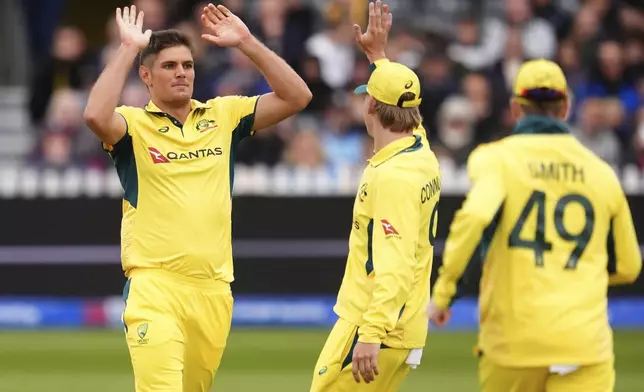 Australia's Aaron Hardie, left, celebrates taking the wicket of England's Will Jacks during the fifth one day international match between England and Australia, at the Seat Unique Stadium, Bristol, England, Sunday Sept. 29, 2024. (Adam Davy/PA via AP)