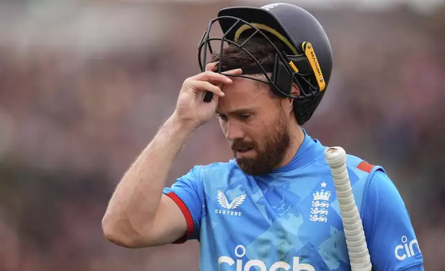 England's Phil Salt leaves the field after being dismissed by Australia's Aaron Hardie during the fifth one day international match between England and Australia, at the Seat Unique Stadium, Bristol, England, Sunday Sept. 29, 2024. (Adam Davy/PA via AP)