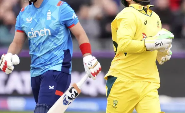 Australia's Josh Inglis, right, celebrates taking the wicket of England's Liam Livingstone during the fifth one day international match between England and Australia, at the Seat Unique Stadium, Bristol, England, Sunday, Sept. 29, 2024. (Adam Davy/PA via AP)