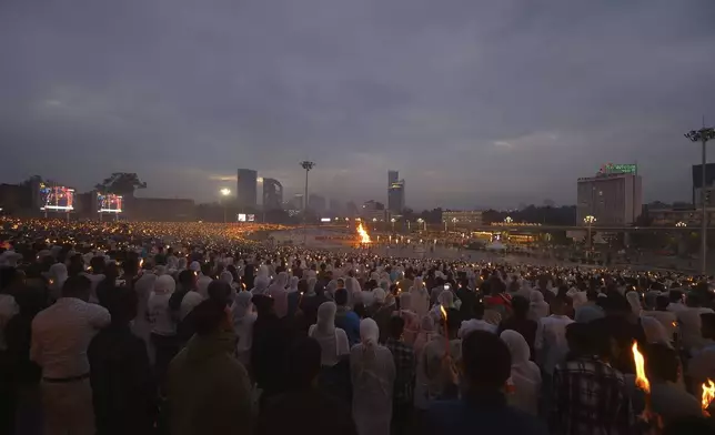 Ethiopian Orthodox Christians celebrate the Meskel festival in the capital, Addis Ababa, Ethiopia Thursday, Sept. 26, 2024. (AP Photo)