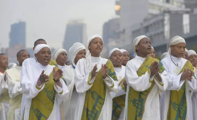 Ethiopian women sing to celebrate Meskel, meaning the Cross in Amharic, is an annual religious holiday among Orthodox in Addis Ababa, Ethiopia Thursday, Sept. 26, 2024. (AP Photo)