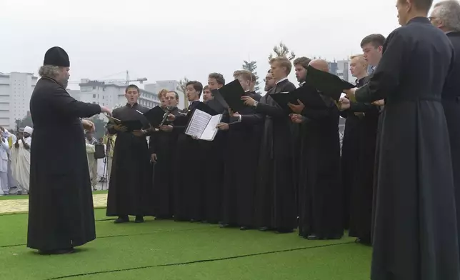 Religious leaders sing to celebrate Meskel, meaning the Cross in Amharic, is an annual religious holiday among Orthodox in Addis Ababa, Ethiopia Thursday, Sept. 26, 2024. (AP Photo)