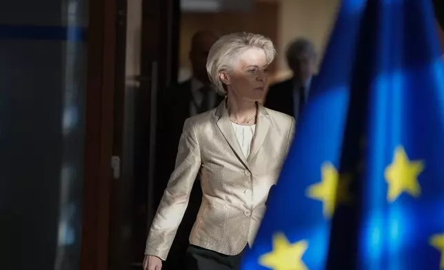 File - European Commission President Ursula von der Leyen, center, arrives for the weekly College of Commissioners meeting at EU headquarters in Brussels, Sept. 28, 2022. (AP Photo/Virginia Mayo, File)