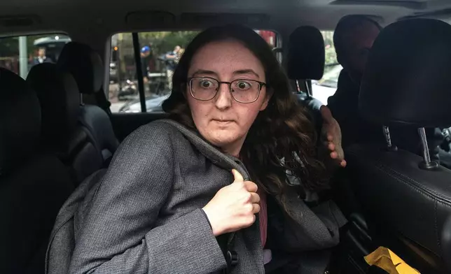 FILE - Caroline Ellison former CEO of Alameda Research founded by Sam Bankman-Fried goes into a wrong car as she exits the Manhattan federal court after testifying on Tuesday, Oct. 10, 2023, in New York. (AP Photo/Eduardo Munoz Alvarez, File)