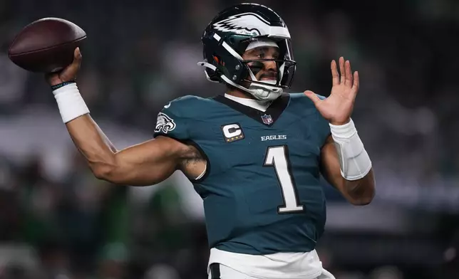 Philadelphia Eagles quarterback Jalen Hurts warms up before an NFL football game against the Atlanta Falcons on Monday, Sept. 16, 2024, in Philadelphia. (AP Photo/Matt Slocum)