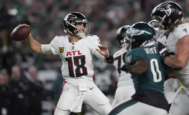 Atlanta Falcons quarterback Kirk Cousins (18) looks to pass during the first half of an NFL football game against the Philadelphia Eagles on Monday, Sept. 16, 2024, in Philadelphia. (AP Photo/Matt Rourke)