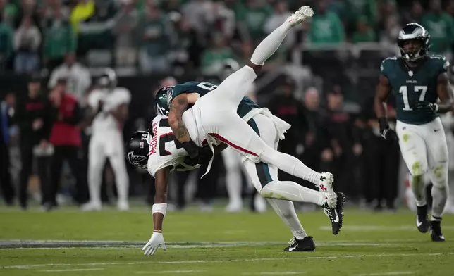 Atlanta Falcons wide receiver Ray-Ray McCloud III (34) is tackled by Philadelphia Eagles linebacker Zack Baun (53) after a catch during the second half of an NFL football game Monday, Sept. 16, 2024, in Philadelphia. (AP Photo/Matt Slocum)