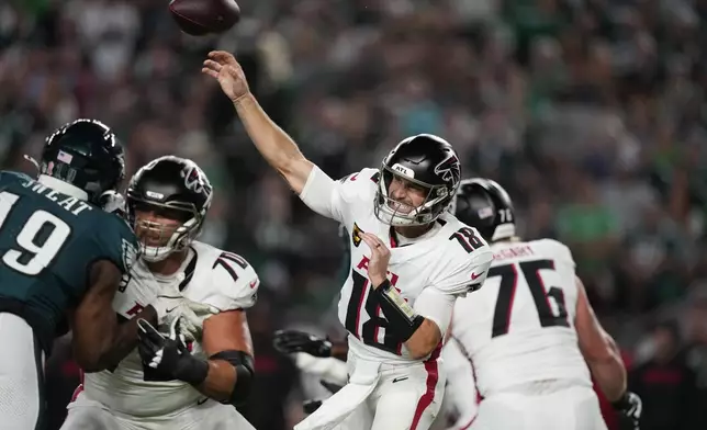 Atlanta Falcons quarterback Kirk Cousins (18) throws during the first half of an NFL football game against the Philadelphia Eagles on Monday, Sept. 16, 2024, in Philadelphia. (AP Photo/Matt Slocum)