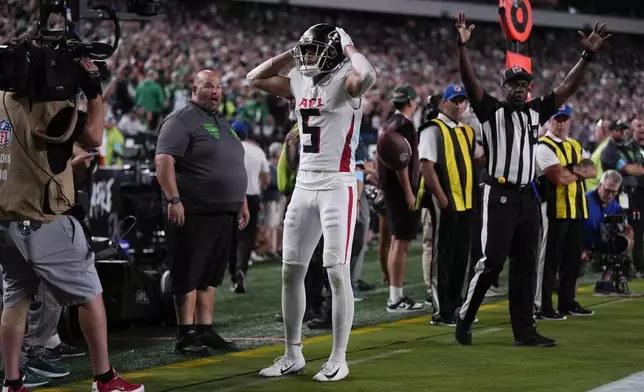 Atlanta Falcons wide receiver Drake London reacts to scoring a touchdown during the second half of an NFL football game against the Philadelphia Eagles on Monday, Sept. 16, 2024, in Philadelphia. (AP Photo/Matt Rourke)