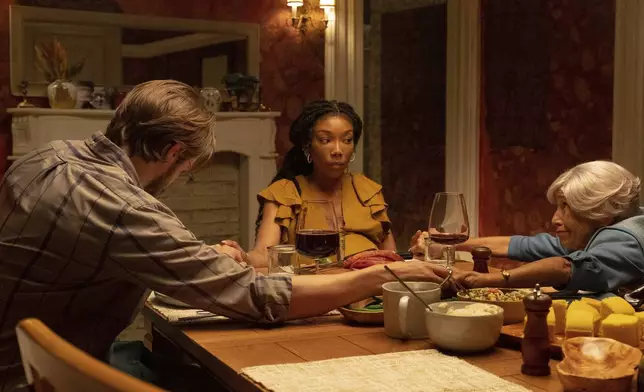 This image released by A24 shows Andrew Burnap, from left, Brandy Norwood, and Kathryn Hunter in a scene from "The Front Room." (A24 via AP)