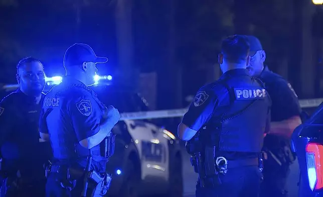 This image provided by WBMA shows police working on the scene of a shooting in Birmingham, Ala., Sunday, Sept. 22, 2024. (Bill Castle/WBMA via AP)